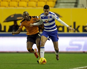 Wolves V Reading - Sky Bet Championship - Molineux Prints: Intense Rivalry: Afobe vs. Hector Battle in Wolverhampton Wanderers vs