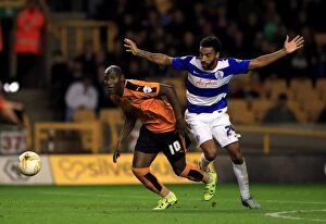 Images Dated 19th August 2015: Intense Rivalry: Afobe vs. Perch - Wolves vs. QPR Championship Showdown at Molineux