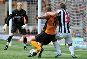 Wolves v West Bromwich Albion Collection: Intense Rivalry: Henry vs. Cox Clash in Wolverhampton Wanderers vs
