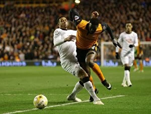 Sky Bet Championship - Wolves v Derby County - Molineux Stadium Collection: Intense Rivalry: Sako vs Christie Battle at Molineux Stadium - Sky Bet Championship Showdown