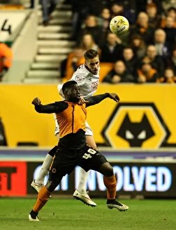 Sky Bet Championship - Wolves v Derby County - Molineux Stadium Collection: Intense Rivalry: Wolves vs. Derby County - A Battle for Championship Supremacy: Dicko vs. Albentosa