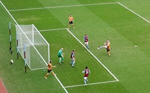 Aston Villa v Wolves Collection: James Milner's Unintended Strike: Wolves 1-2 Lead Over Aston Villa (Premier League Soccer)