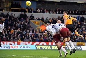 Images Dated 21st January 2012: Johnson's Dramatic Header: Wolves Take a 2-1 Lead Over Aston Villa in Premier League Soccer