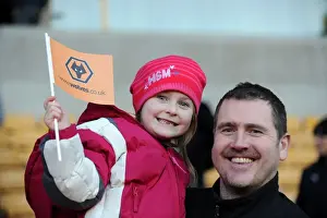 Framed Print : Jubilant Wolves Fans Celebrate Premier League Victory over Blackpool with Flag Wave at Molineux Stadium Framed Print : Jubilant Wolves Fans Celebrate Premier League Victory over Blackpool with Flag Wave at Molineux Stadium