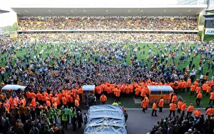 Jubilant Wolves Fans Celebrate Promotion to Premier League on Molineux Pitch (2009)