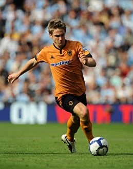 Manchester City vs Wolves Collection: Kevin Doyle at City of Manchester Stadium: A Determined Moment for Wolverhampton Wanderers Against