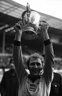 League Cup Final, Wolves vs Manchester City, Captain Mike Bailey holds aloft the trophy