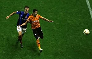 Images Dated 21st August 2012: Matthew Jarvis's Evasive Move Against Scott Wiseman: Wolverhampton Wanderers vs Barnsley