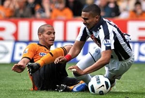 Wolves v West Bromwich Albion Collection: Penalty Dispute: Guedioura's Foul on Thomas - Wolverhampton Wanderers vs. West Bromwich Albion