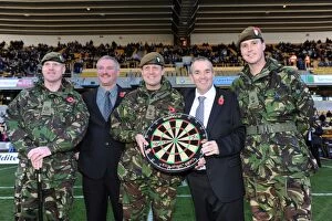 Wolves v Bolton Collection: Phil Taylor Honors Armed Forces at Molineux: A Unique Football-Darts Crossover - Wolverhampton