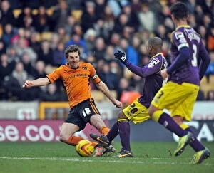 Images Dated 15th February 2014: Ricketts vs Boucard: A Tight Battle in Sky Bet League One - Wolverhampton Wanderers vs Notts County