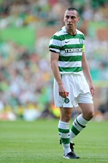 Images Dated 27th July 2011: Scott Brown vs. Wolverhampton Wanderers: A Clash of Captains in Pre-Season Football Action