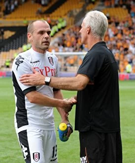 Images Dated 21st August 2011: A Sportsman's Handshake: Mick McCarthy and Danny Murphy End the Wolves vs Fulham Barclays Premier