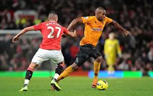 Manchester United V Wolves Prints: A Tactical Battle: Ronald Zubar of Wolverhampton Wanderers Focused Against Manchester United in Premier League Action
