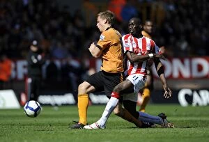Images Dated 11th April 2010: A Tense Clash: Berra vs Sidibe in the Barclays Premier League - Wolverhampton Wanderers vs Stoke