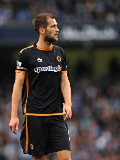 Manchester City v Wolves Collection: A Tense Moment in the Premier League: Roger Johnson's Focus Against Manchester City