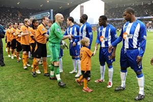Wolves v Wigan Collection: Thrilling Mascot Showdown: Wolverhampton Wanderers vs Wigan Athletic - Barclays Premier League
