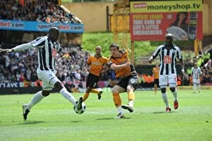 Wolves v West Bromwich Albion Collection: Ward vs. Meite: A Defensive Showdown - Dramatic Shot Block at Wolverhampton Wanderers vs