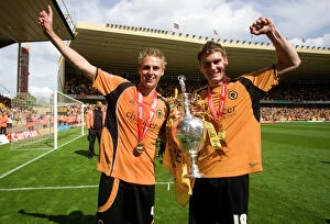Championship Champions Celebration Collection: Wolverhampton Wanderers: Champions League Championship Triumph - Edwards and Vokes with the Trophy
