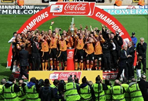 Championship Champions Celebration Collection: Wolverhampton Wanderers: Champions League Championship - Henry and Craddock Lift the Trophy