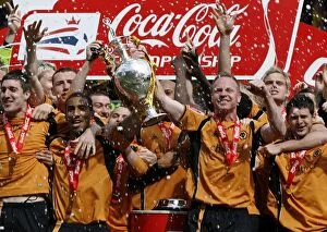 Championship Champions Celebration Collection: Wolverhampton Wanderers: Championship Title Win - Celebrating with the Trophy