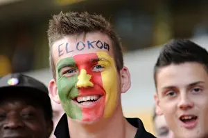 Wolves V Blackburn Rovers Prints: Wolverhampton Wanderers Fan Honors George Elokobi with Flag at Wolves vs