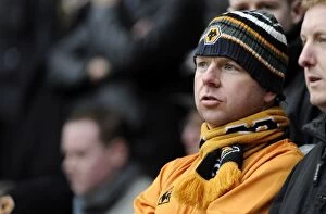 Images Dated 27th February 2010: Wolverhampton Wanderers Fans Unwavering Passion: A Premier League Showdown at Bolton Wanderers
