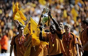 Championship Champions Celebration Collection: Wolverhampton Wanderers: George Elokobi's Euphoric Moment with the Championship Trophy