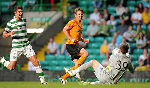 Celtic v Wolves Collection: Wolverhampton Wanderers Kevin Doyle Thwarted by Celtic's Stipe Pletikosa