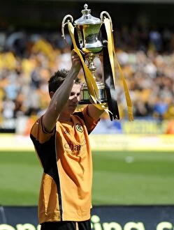 Championship Champions Celebration Collection: Wolverhampton Wanderers: Kevin Foley's Euphoric Moment with the Championship Trophy