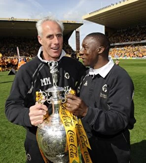 Championship Champions Celebration Collection: Wolverhampton Wanderers: Mick McCarthy and Terry Connor Celebrate Championship Title with the Trophy