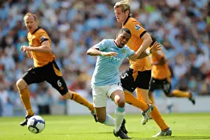 Manchester City V Wolves Prints: Wolverhampton Wanderers Richard Stearman vs Manchester City's Robinho: A Yellow Card Battle in the 2009 BPL Clash