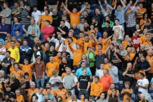 Images Dated 13th August 2011: Wolverhampton Wanderers: Triumphant Fans Celebrate Victory over Blackburn Rovers in Premier League