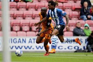 Wolverhampton Wanderers vs. Wigan Athletic: Intense Clash Between Benik Afobe and Gaetan Bong in Sky Bet Championship