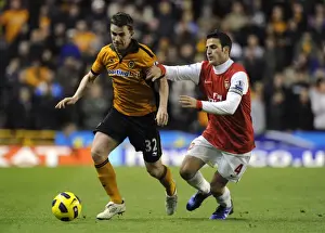 Player Prints: Wolverhampton Wanderers vs Arsenal: A Clash of Football Titans - A Battle between Kevin Foley and Cesc Fabregas