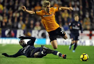 Framed Print : Wolverhampton Wanderers vs Arsenal: A Premier League Battle - Doyle vs Gallas
