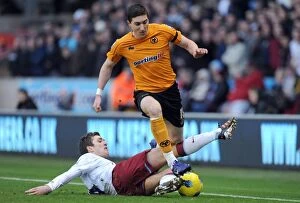 Images Dated 21st January 2012: Wolverhampton Wanderers vs Aston Villa: Intense Encounter between Stephen Ward