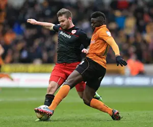 Season 2012-13 Prints: Wolverhampton Wanderers vs. Cardiff City: A Championship Showdown - Midfield Battle between Sako and Gunnarsson