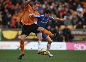 Wolves v Chelsea Collection: Wolverhampton Wanderers vs. Chelsea: Berra vs. Cole - A Football Rivalry: Clash of the Titans