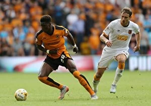 Images Dated 16th August 2015: Wolverhampton Wanderers vs Hull City: Clash at Molineux - Kortney Hause vs Nikica Jelavic
