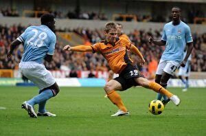 Wolves v Man City Collection: Wolverhampton Wanderers vs Manchester City: A Battle Between Kevin Doyle