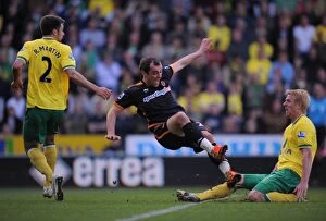 Images Dated 24th March 2012: Wolverhampton Wanderers vs. Norwich City: Milijas Fouls Whitbread in Intense Barclays Premier