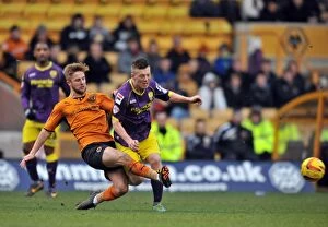 Images Dated 15th February 2014: Wolverhampton Wanderers vs Notts County: A Fight for Possession - Sky Bet League One
