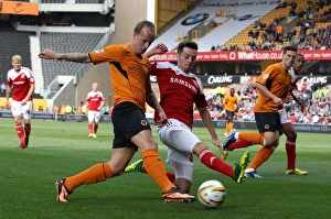 Sky Bet League One : Wolves V Swindon Town : Molineux : 14-09-2013 Prints: Wolverhampton Wanderers vs Swindon Town: A Fierce Tussle Between Leigh Griffiths and Ryan Mason in Sky Bet League One