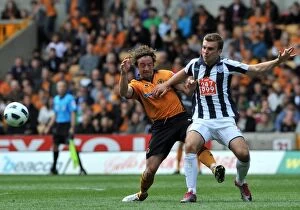 Images Dated 8th May 2011: Wolverhampton Wanderers vs West Bromwich Albion: A Clash of Football Titans - Stephen Hunt vs