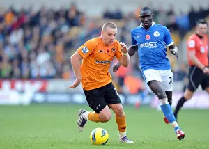 Jamie O'Hara Prints: Wolverhampton Wanderers vs Wigan Athletic: A Clash of Football Titans - Jamie O'Hara vs Mohamed Diame
