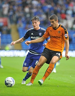 Sky Bet Championship - Cardiff City V Wolves - Cardiff City Stadium Prints: Wolves vs Cardiff City: Intense Moment between Conor Coady and Joe Mason in Sky Bet Championship