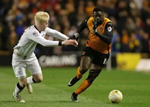 Sky Bet Championship - Wolves v Derby County - Molineux Stadium Collection: Wolves vs Derby County: Intense Battle Between Bakary Sako and Will Hughes in Sky Bet Championship