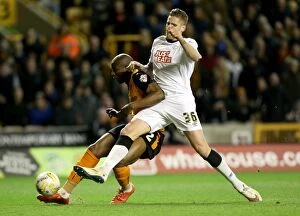 Sky Bet Championship - Wolves v Derby County - Molineux Stadium Collection: Wolves vs Derby County: Intense Battle for Supremacy - Afobe vs Albentosa at Molineux Stadium