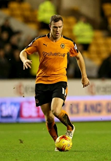 Sky Bet Championship - Wolves V Leeds United - Molineux Stadium Prints: Wolves vs Leeds United: Kevin McDonald's Determination in the 2014-15 Sky Bet Championship at Molineux